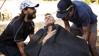 Friends carry the Tahoe 200 winner, Kyle Curtin, as he shakes uncontrollably after finishing the race, in Homewood, California, Photograph: Max Whittaker/The New York Times