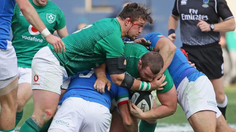 Ireland prop Jack McGrath  is supported by Andrew Porter as he is tackled  by George Fabio Biagi and Luca Bigi of Italy  during  the match against Italy at Soldier Field in Chicago on Saturday. Photograph: Jonathan Daniel/Getty Images