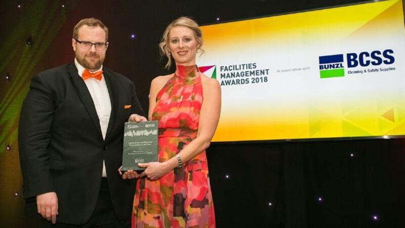 Páraic O’ Lochainn, General Manager, eMaint presents the Client & Service Provider Partnership of the Year award to Jennifer Chapman, FBD & Derrycourt Cleaning Specialists