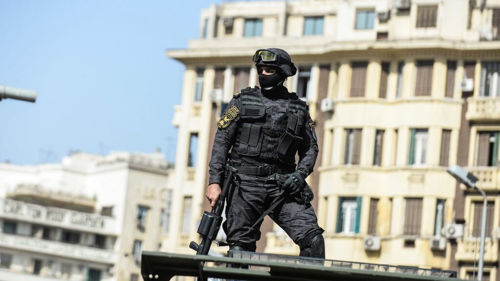 A police officer in Cairo, Egypt, on April 15th. Public anger over allegations of police brutality has been bubbling over the past months, with several incidents spilling over into skirmishes and protests. Photograph: Mohamed Hossam/EPA