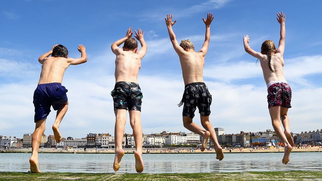 Children enjoy jumping into a sea pool in Margate, Kent. Photograph: Gareth Fuller/PA Wire