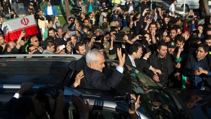 Iranian foreign minister Mohamad Javad Zarif greets his supporters as he arrives from Lausanne, Switzerland to Mehr-Abad airport in Tehran. Iran and six world powers have agreed on the key points of a deal over Iran’s controversial nuclear programme. Iranians are so happy by hearing that world powers are ready to lift the sanctions against the country. Photograph: Borna Qasemi/EPA