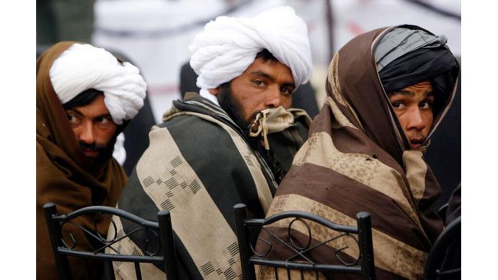 Afghan Taliban look on after handing over their weapons as they join the Afghan government's reconciliation and reintegration program in Herat province. Photograph: Mohmmad Shoib/Reuters