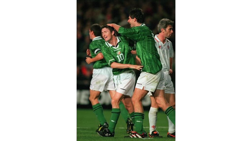 Niall Quinn congratulating Robbie Keane on the night the striker opened his international acount with two goals against Malta in October 1998. - (Photograph: Lorraine O'Sullivan/INPHO)