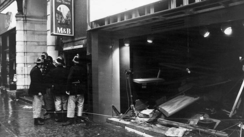 Firemen survey the damage outside the Tavern in the Town pub in Birmingham after an IRA bomb attack in 1974. Photograph: Wesley/Keystone/Getty Images