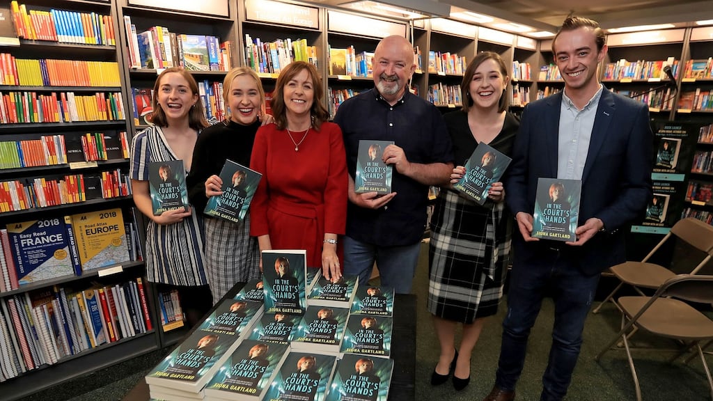 Fiona Gartland with husband Paul and children Rose, Katie, Jeni and Paul jnr at the launch of her book, In the Court’s Hands, in Hodges and Figgis on Dawson Street, Dublin on Friday. Photograph: Donall Farmer for The Irish Times