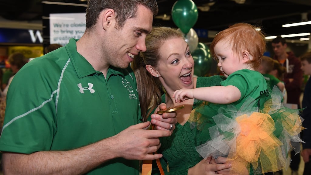 Gold medal winning sprinter Jason Smyth speaks to his 10-month-old daughter Evie, and his wife Elise on his return to Dublin Airport from the Rio 2016 Paralympic Games. Photograph: Cody Glenn/Sportsfile.