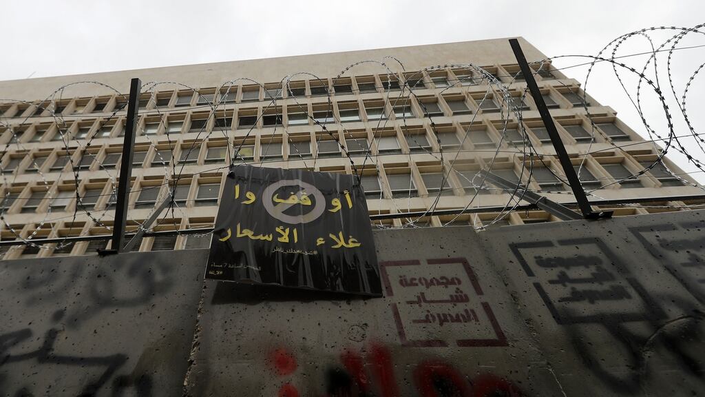 A banner left on a wall outside Lebanon’s central bank building by anti-government protesters reads in Arabic ‘Stop the rise of prices’ in the capital Beirut. File photograph: Getty