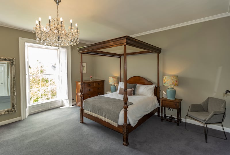 Another bedroom complete with four poster bed