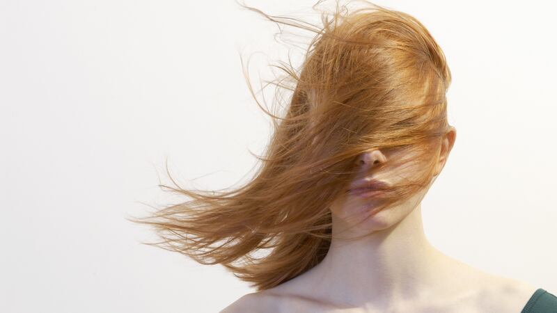 If there was the slightest breeze, your poker-straight locks would be ruined every time you had to ungloop them from your glossed lips