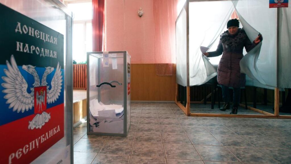 A woman leaves a voting booth during the self-proclaimed Donetsk People’s Republic leadership and local parliamentary elections yesterday. Photograph: Reuters/Maxim Zmeyev