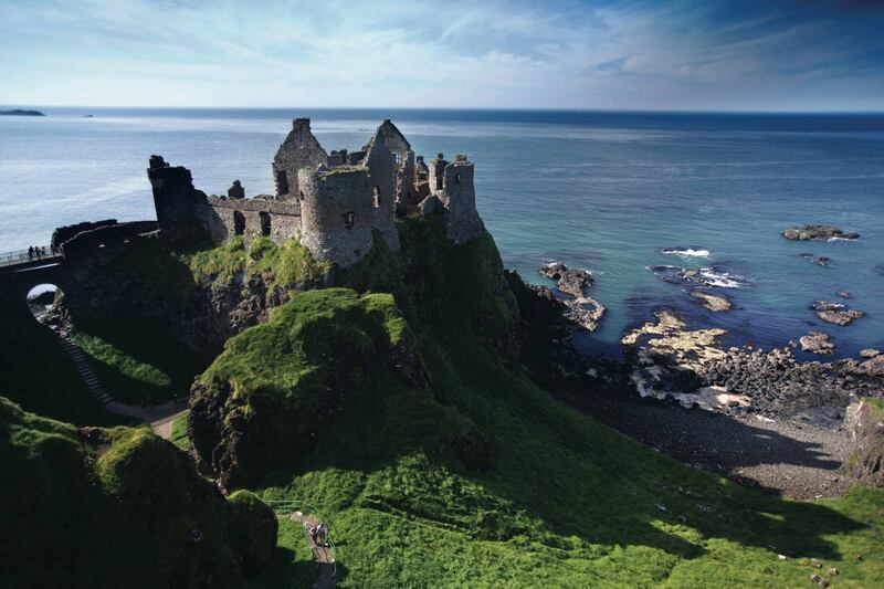 Surrounded by jaw dropping coastal scenery, Dunluce Castle stands where an early Irish fort was once built and its history can be traced back to early Christians and Vikings. Photograph: Brian Morrison