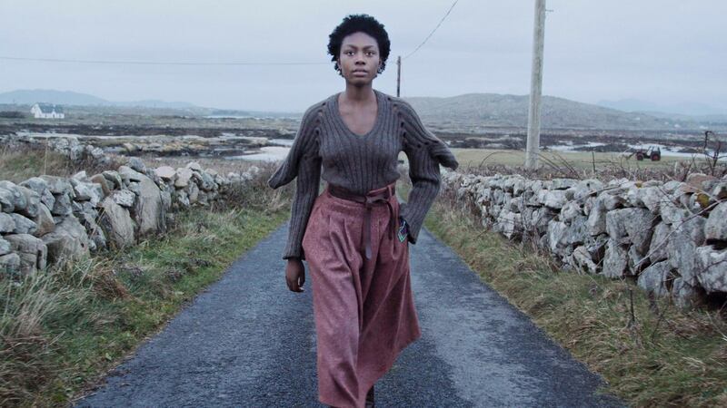 Somto in Fintan Mullholland knit, skirt by Bernie Murphy, belt by de Bruit and earrings by Chupi. Film still: Perry Ogden/Showcase 2019