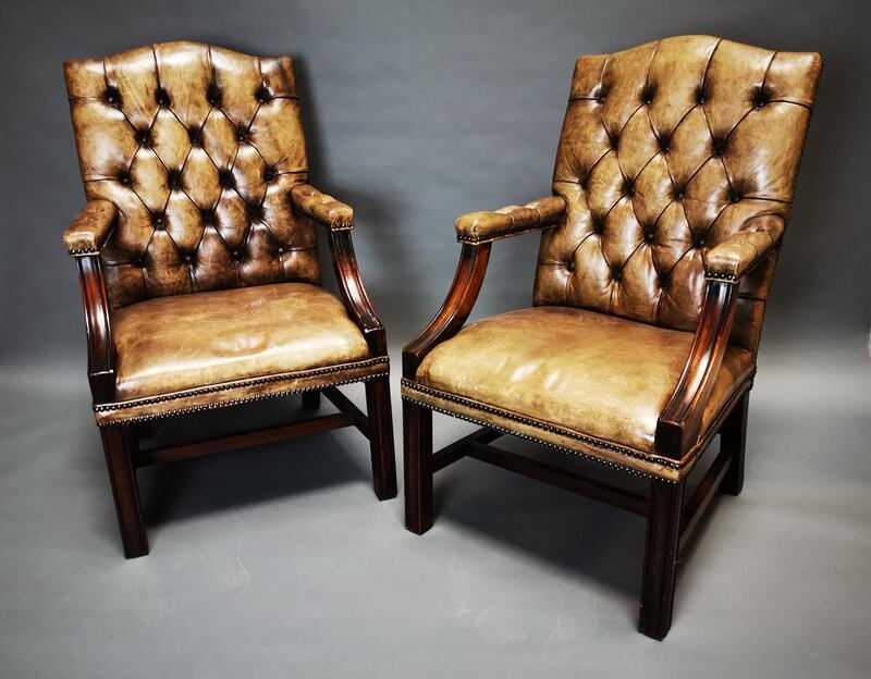 Pair of deep-buttoned armchairs, €500-700.