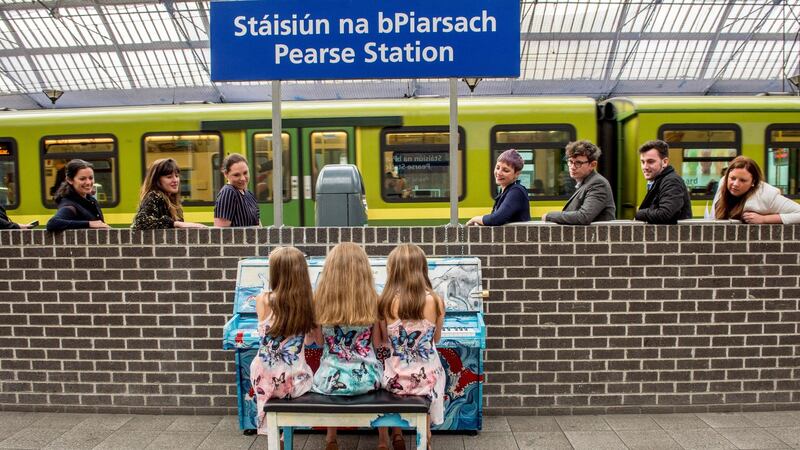 Aela O’Sullivan age 10 and her twin sisters Siun and Eavan age 9 from Cavan were first to play the newly installed piano on the southbound platform of Pearse Station which is there to encourage the commuters to play.Photograph: Brenda Fitzsimons