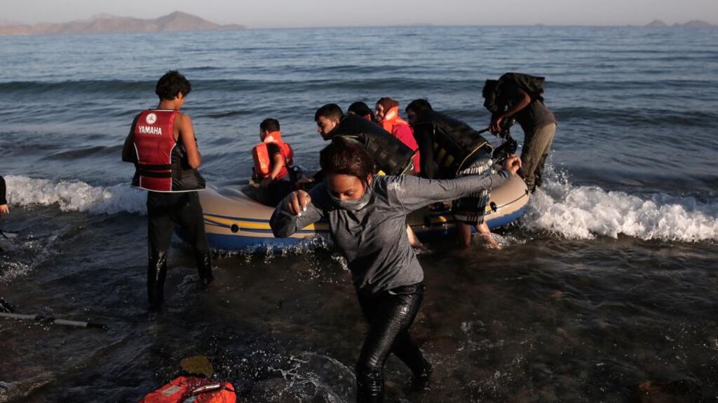 File photo: Migrants arrive on the shores of Kos after travelling across the Aegean Sea from Turkey. Local media reported that 22 people have died after attempting to make the same journey on Tuesday. Photograph: in McNamee/Getty Images