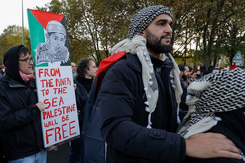 A demonstrator holds a placard with the slogan `From the river to the sea, Palestine will be free' during a protest in Berlin in November 2023. Photograph: Odd Andersen/AFP via Getty Images