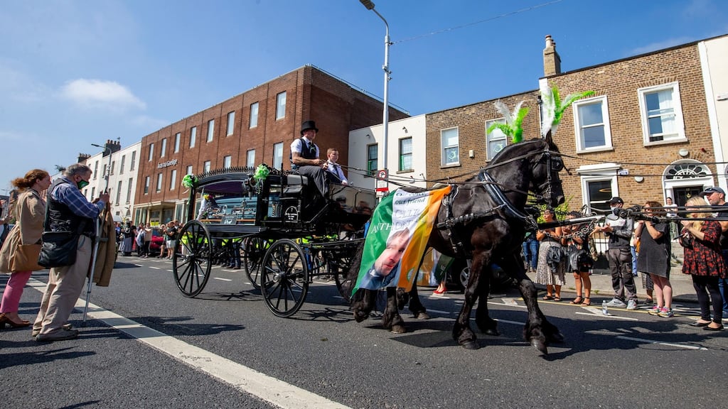 The funeral cortège of  Anthony Flynn as it passed the Inner City Helping Homeless office on Amiens Street in Dublin on Tuesday. Photograph: Tom Honan