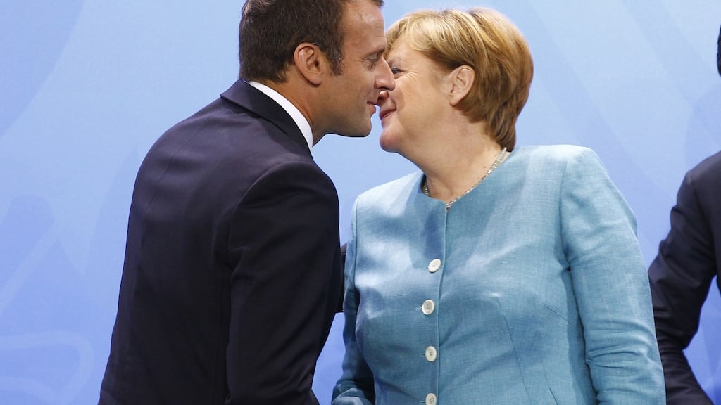 German chancellor Angela Merkel and French president Emmanuel Macron shake hands after a meeting of EU leaders in Berlin. Photograph: Michele Tantussi/Getty Images