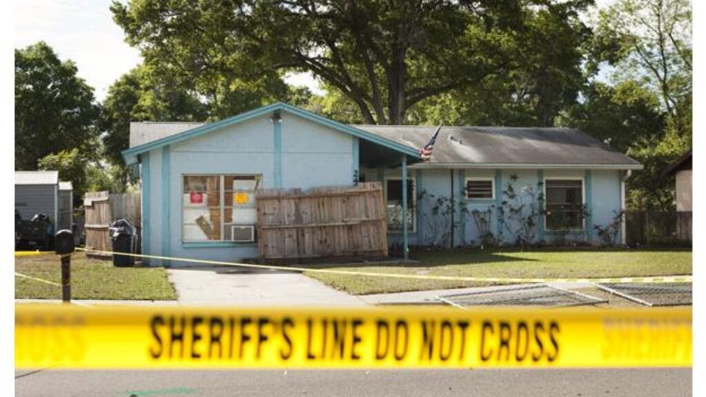 Police tape surrounds the house of Jeff Bush, who was consumed by a sinkhole while lying in his bed on Thursday night. Photograph: Edward Linsmier/Getty Images