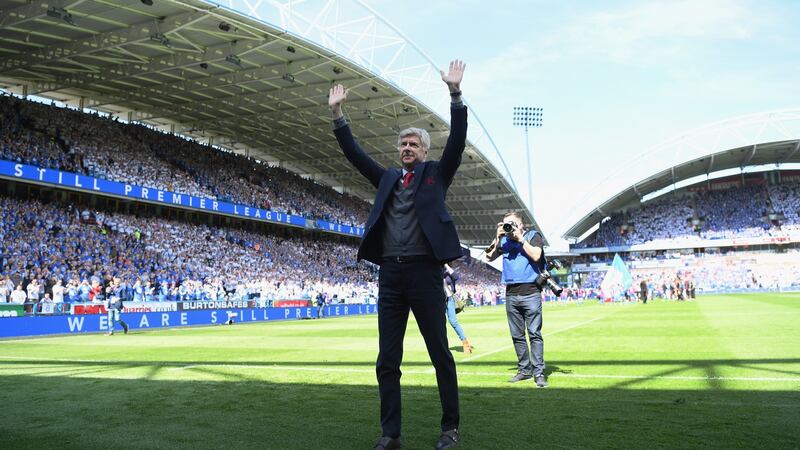Arsène Wenger on the pitch after his final game in charge against Huddersfield. Photograph: Shaun Botterill/Getty