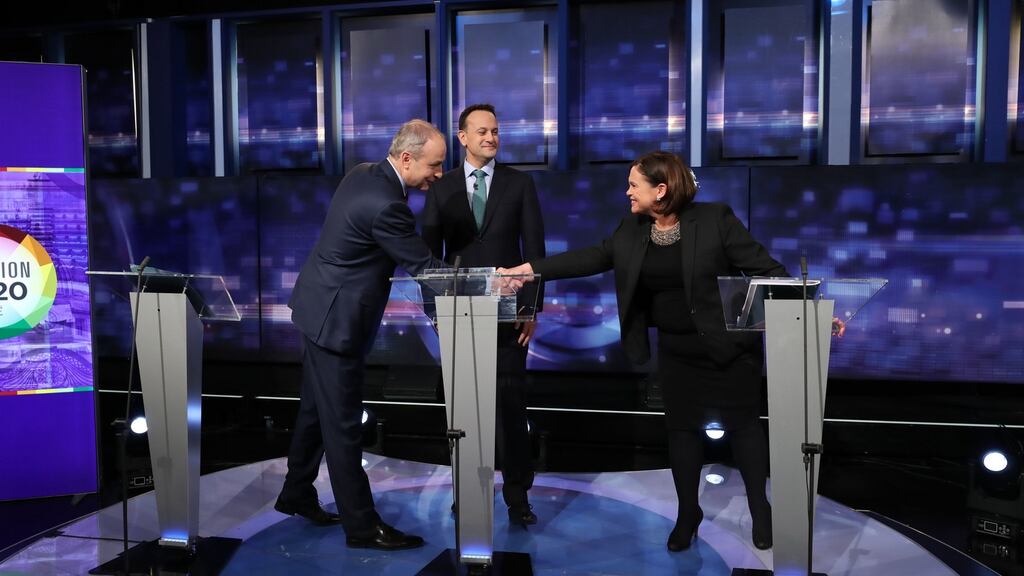 Fianna Fáil leader Micheál Martin shakes hands with Sinn Féin president Mary Lou McDonald as Fine Gael leader Leo Varadkar looks on at the final TV leaders’ debate at the RTÉ studios in Donnybrook, Dublin in February, 2020. Photograph: Niall Carson/PA Wire