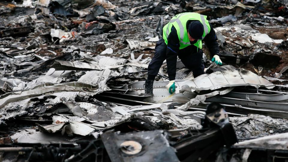 A Dutch investigator works at the site where flight MH17 crashed, near the village of Grabovo in the Donetsk region. Photograph: Reuters