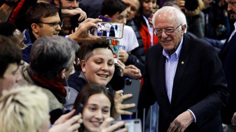 Bernie Sanders poses with students for selfies at a campaign rally in Rindge, New Hampshire. Photograph: Mike Segar/Reuters