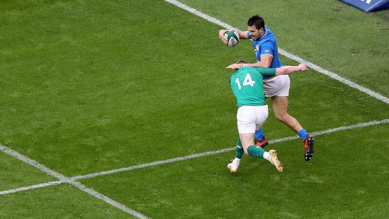 Keith Earls sprinted 95 yards to make a saving tackle on Mattia Bellini. It epitomised Ireland’s attitude all season. Photograph: Tommy Dickson/Inpho