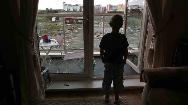 A child at his apartment window in the unfinished estate of Belmayne, Dublin, in 2011. File photograph: Fran Veale