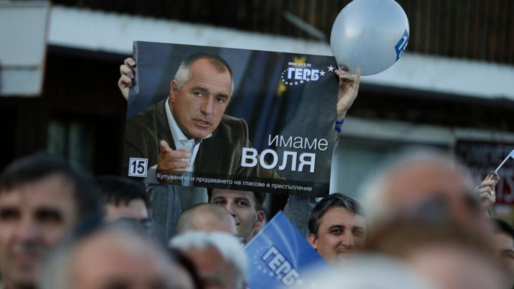 A supporter of Bulgaria’s centre-right Gerb party holds a poster of party leader Boiko Borisov during an election rally in the city of Veliko Tarnovo yesterday. Photograph: Reuters/Stoyan Nenov