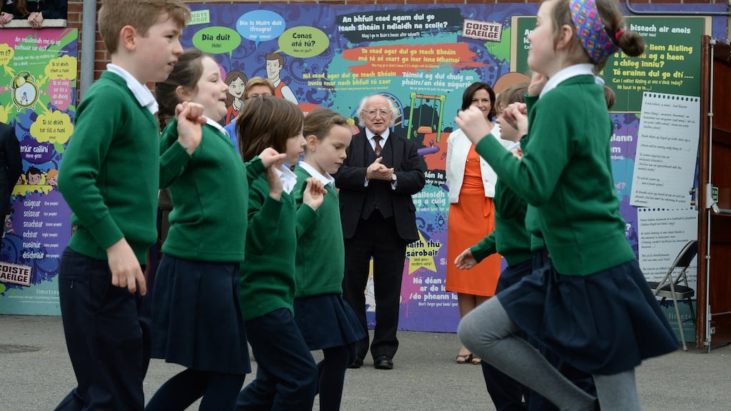 President Michael D Higgins looks on as pupils at Scoil Bhride perform a set dance during his visit to celebrate the 100th anniversary of the school’s foundation. Photograph: Cyril Byrne/The Irish Times