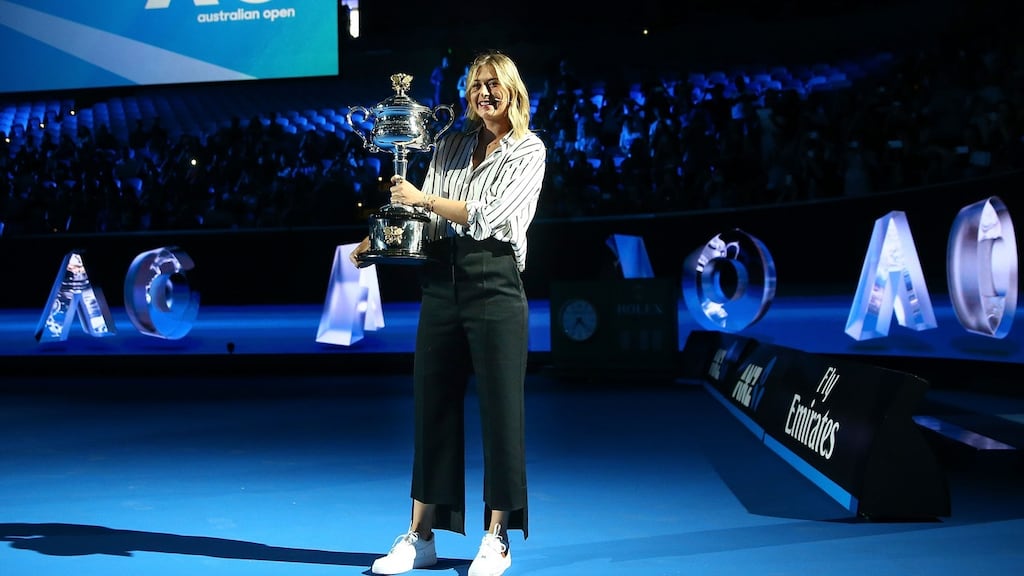 Maria Sharapova of Russia arrives on court with the the Daphne Akhurst Trophy during the 2018 Australian Open Official Draw at Melbourne Park. Photo: Scott Barbour/Getty Images