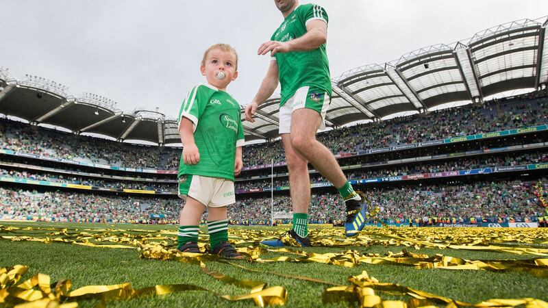 Limerick’s Tom Condon celebrates his side’s 2018 All-Ireland win with his son Nicky. Photograph: Tommy Dickson/Inpho
