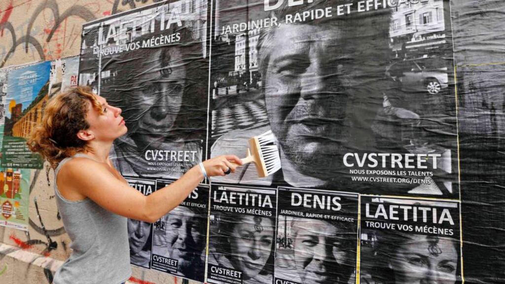 Laetitia, a 30-year-old unemployed Frenchwoman and member of CVStreet group, uses a brush to paste posters of herself and others unemployed people in the streets of Marseille. The main idea is to break the anonymity for the unemployed by posting their portraits in the street.