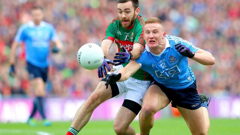 Mayo’s Kevin McLoughlin and Ciaran Kilkenny of Dublin. Photo: James Crombie/Inpho