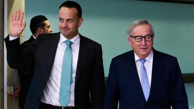 Taioseach Leo Varadkar waves as he walks past European Commission president Jean-Claude Juncker at the European Commission headquarters in Brussels on February 6th. Photograph: Aris Oikonomou/AFP/Getty Images