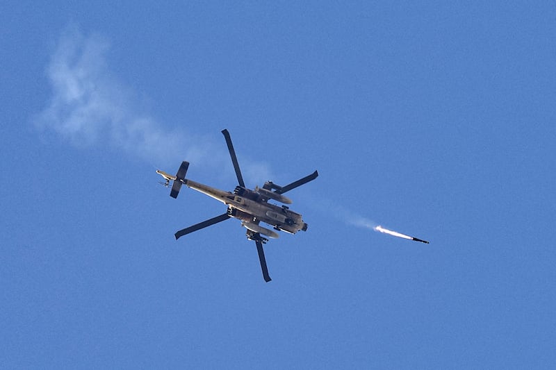 An Israeli air force attack helicopter fires a missile over Gaza. Photograph: Jack Guez/AFP via Getty Images