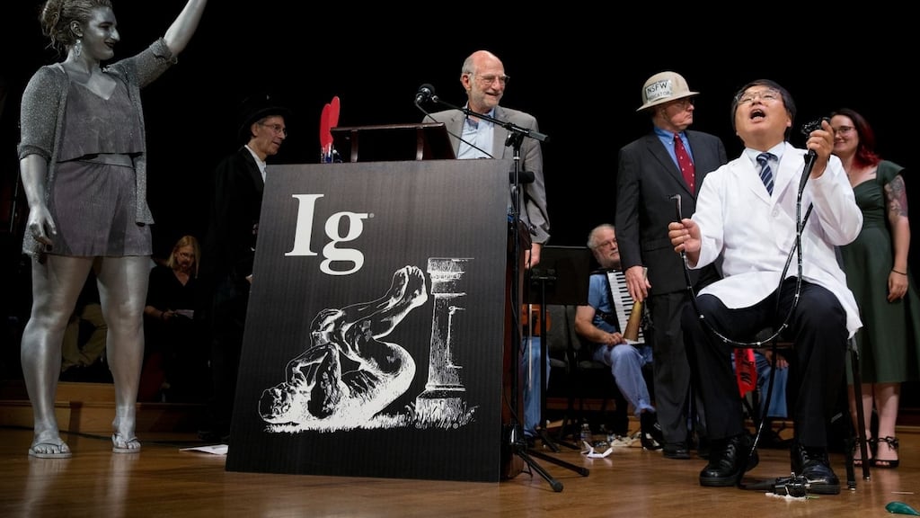 Akira Horiuchi, winner of this year’s Ig Nobel for Medical Education, demonstrates his self-colonoscopy technique during the award ceremony at Harvard University. Photograph: AP