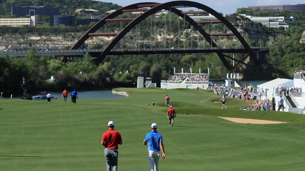 Jon Rahm  and Dustin Johnson walk down the 12th hole during the final  of the WGC-Dell  Match Play at the Austin Country Club. Photograph: Richard Heathcote/Getty Images
