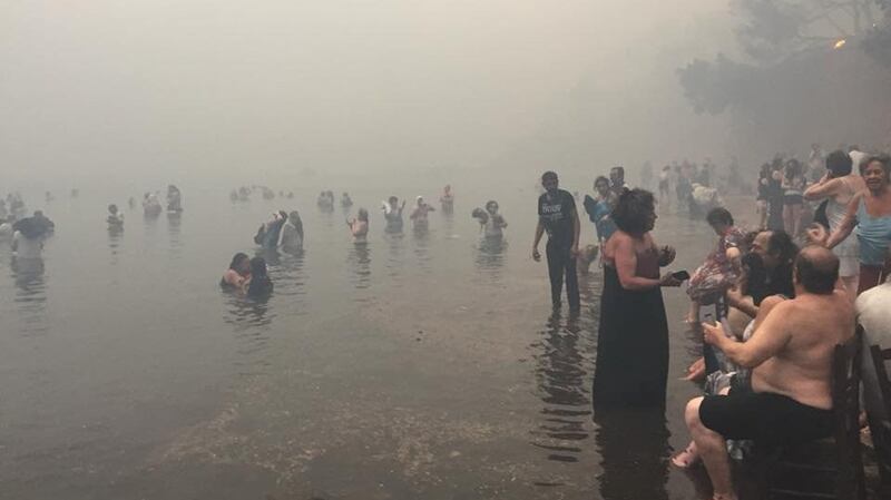 People attempt to escape the wildfire in Mati, Greece, on Monday. Photograph: Kalogerikos Nikos via Reuters