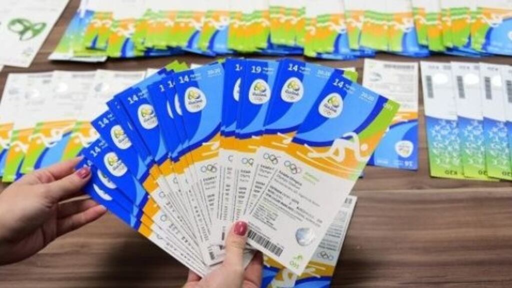Seized Olympic tickets allegedly are displayed during a press conference. Photograph: Getty Images