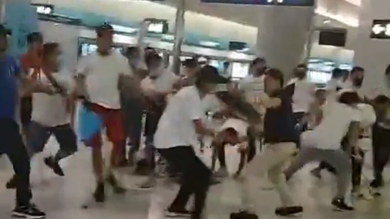 A mob of men in white T-shirts clashing with pro-democracy protesters on the platform of Yuen Long station in Hong Kong. Photograph: AFP/Getty Images