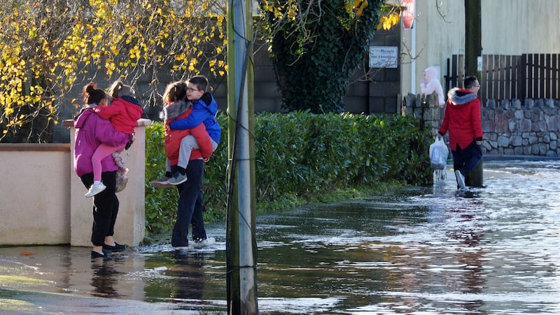 Local residents on Manor Road in Mountmellick, where up to half a metre of water flooded into homes on Wednesday. Photograph: Alan Betson/The Irish Times
