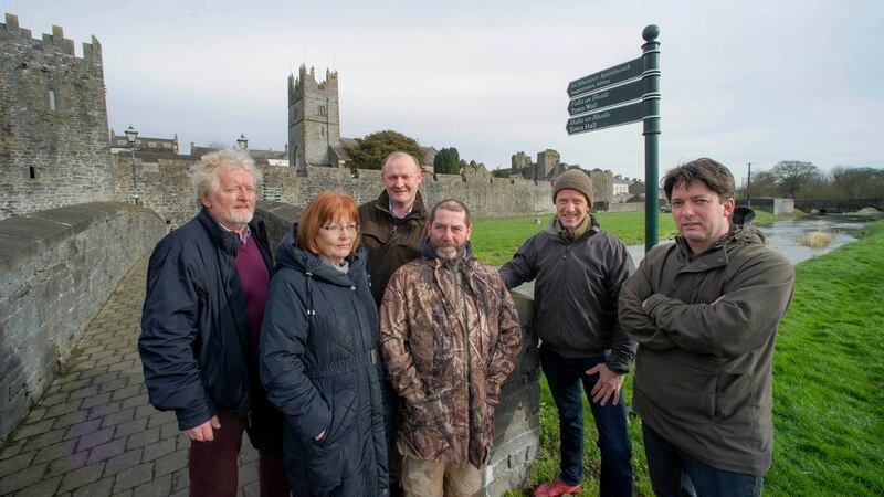 Concerned locals at the pedestrian bridge over the Clashawley river at Fethard, Co Tipperary, with the medieval town walls in the background. Photograph: L to R: Terry Cunningham (Fethard Historical Society), Mary Hanrahan (Fethard Historical Society), Kevin Collins (Birdwatch Ireland), Colm Hackett (Fethard & Killusty Anglers), Alan Moore and Vincent McCarthy