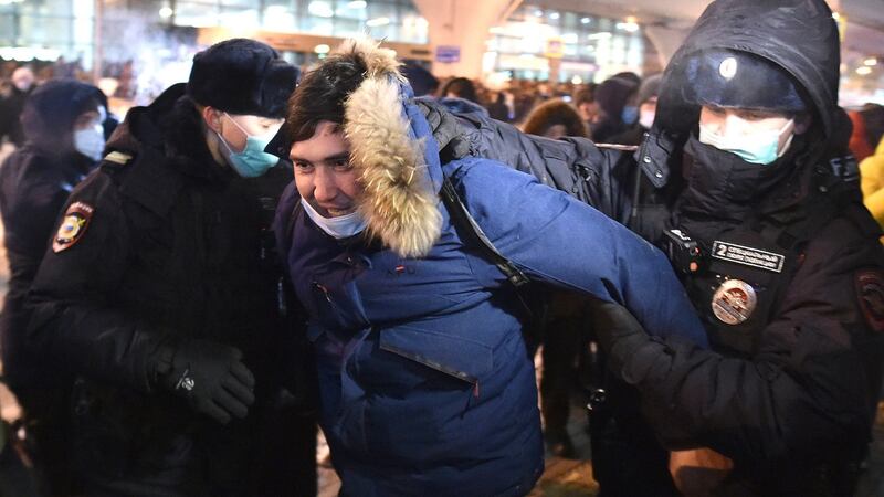Police officers detain a man at Moscow’s Vnukovo airport where Russian opposition leader Alexei Navalny was expected to arrive on Sunday before his flight was diverted. Photograph: Dmitry Serebryakov/AP