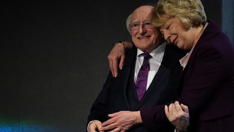 President Michael D Higgins is  congratulated by his wife Sabina Higgins during the announcement of the results in Dublin Castle on Saturday. Photograph: Clodagh Kilcoyne/Reuters