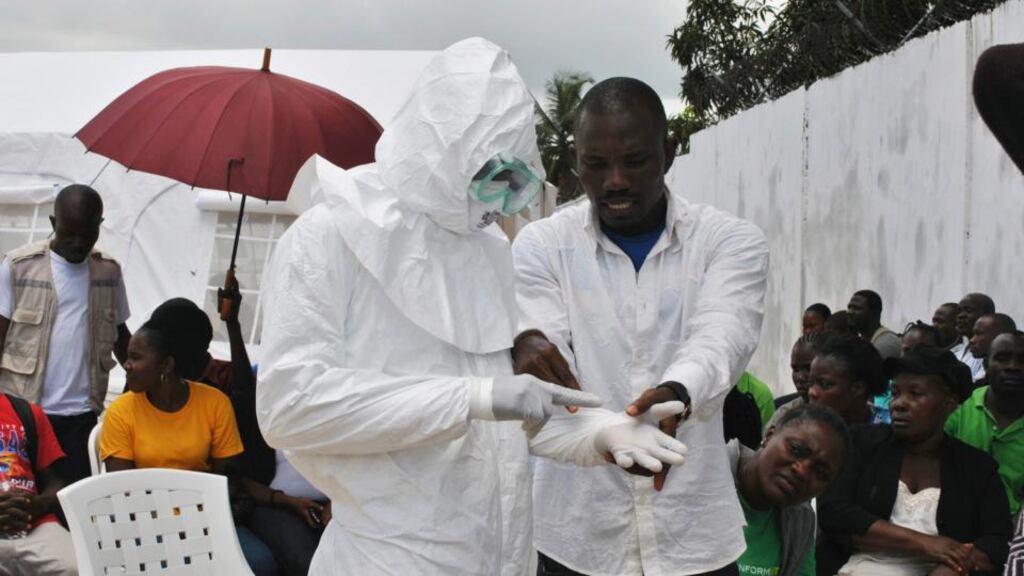 A volunteer health worker wearing a personal protective equipment (PPE) suit at a newly-constructed Ebola virus treatment centre in Monrovia, Liberia. Photograph: James Giahyue/Reuters.