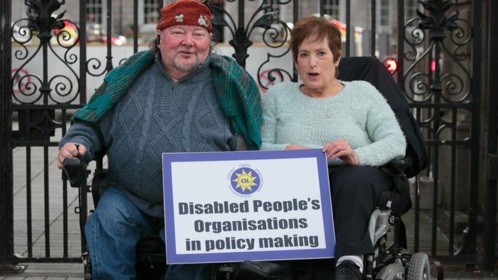 Disability protesters Martin Naughton from Baldoyle and Ann Richards from Knocklyon at a protest to draw attention to inequalities and abuses experienced by people with disabilities and their families due to funding shortfalls and cuts at Leinster House on Thursday. Photograph: Gareth Chaney Collins