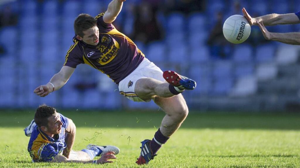 Wexford’s John Tubritt attempts a shot which is blocked at Pearse Park. Photograph: Inpho